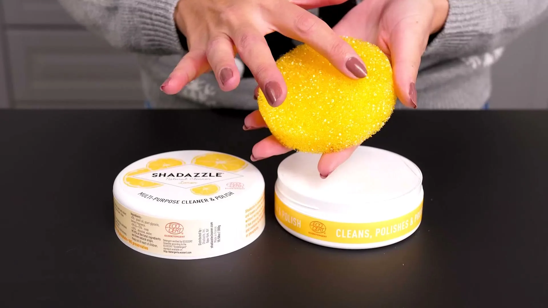 The Shadazzle sponge lifted out of an open tub of Cleaner & Polish